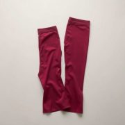 Burgundy flare leggings plus size flared activewear pants folded neatly on a neutral surface, top-down view.