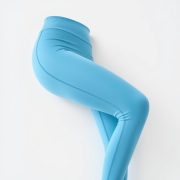 Sky Blue high waisted leggings, flared leggings Australia, on white background, photorealistic studio shot.