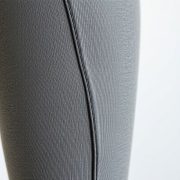 Close-up of high waisted leggings fabric, showcasing texture and stitching, made from recycled materials in Australia.