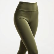 High waisted yoga pants in olive green, petite fit, studio shot on white background, hyperrealistic 8k image.