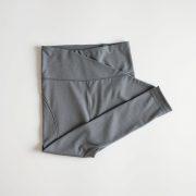 Heather Grey scrunch bum leggings sale high waisted tights folded neatly on a neutral surface, top-down flat lay.