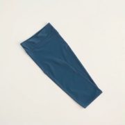 Flat lay of sky blue seamless high waisted leggings folded neatly on a neutral surface, black seamless leggings alternative.