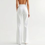 A model wearing white wide leg yoga pants with scrunch bum in a studio on pure white background.