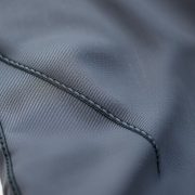 Close-up of moisture-wicking performance fabric on yoga pants men straight leg yoga pants, showing texture and stitching.